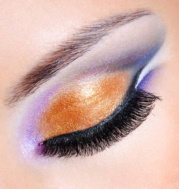 Free photo brightly colors of a fashion makeup - macro shot