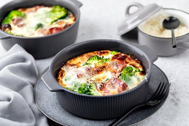 Broccoli bacon Cheese Bake on a gray stone background