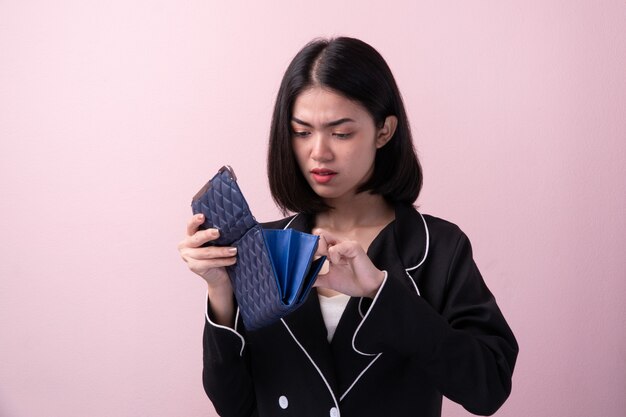 Premium Photo | Broke asian women open empty purse isolated on background