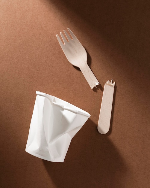 Broken bio cardboard forks and crushed cup