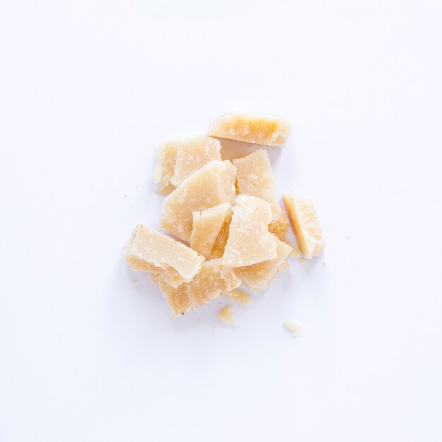 Broken cheese isolated on white background