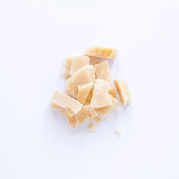 Broken cheese isolated on white background