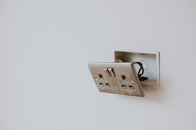 Broken power outlet on the wall
