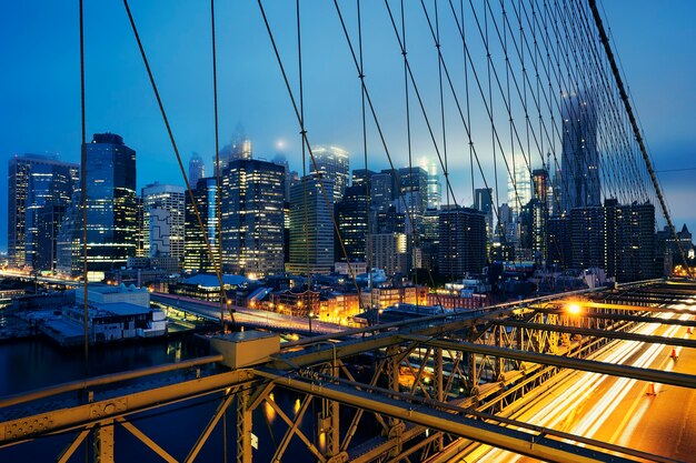 Brooklyn Bridge at night with car traffic