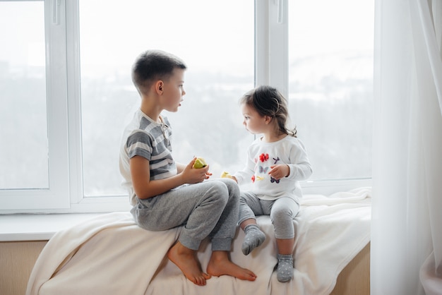 Young Sister On Parents Bed