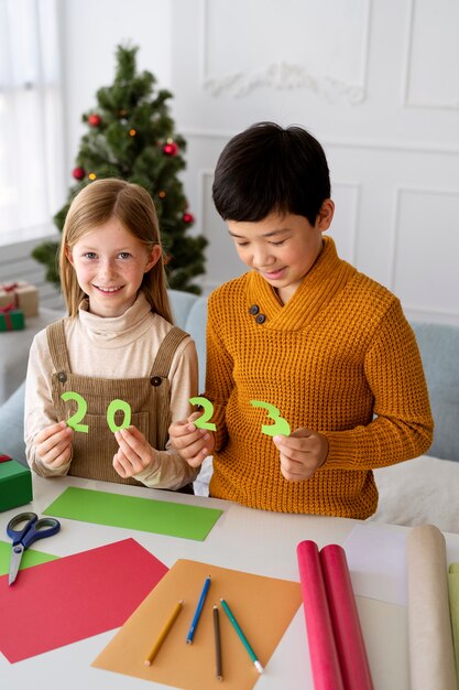 Brother and sister celebrating new years eve at home together