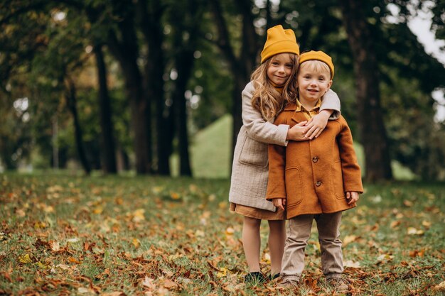 Brother and sister having fun together in park