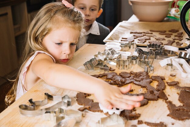 Brothers making gingerbread