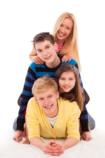 Brothers and sister lying on a floor