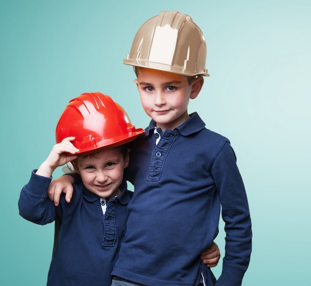 Free photo brothers wearing protective helmets