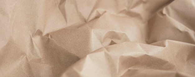 茶色のしわくちゃの再生紙。紙のテクスチャの背景。バナー
