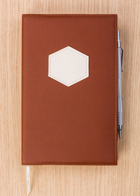 Brown diary with pen