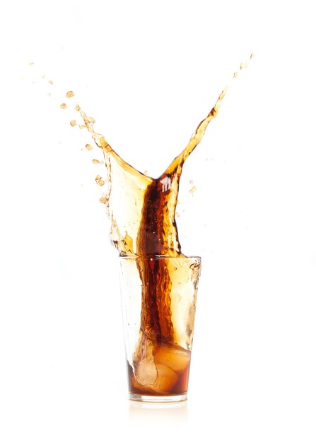 Brown drink falling in ice