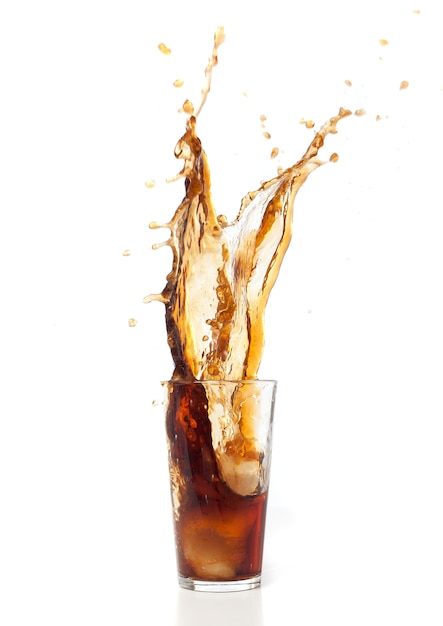 Brown drink falling in ice