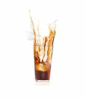 Free photo brown drink falling in ice