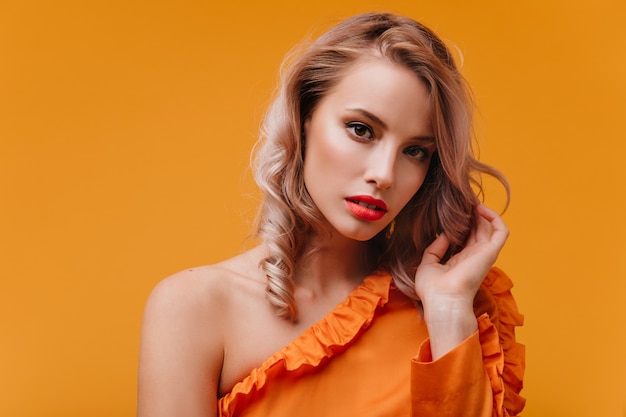 Orange dressed blonde