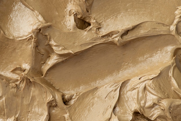 Brown frosting texture background close-up