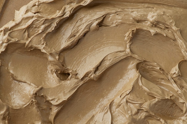 Brown frosting texture background close-up