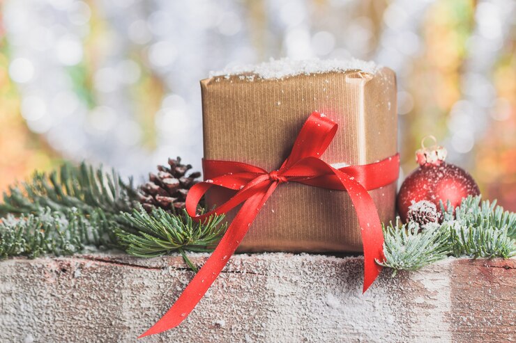 Free Photo brown gift pack with a red bow