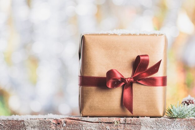 Brown gift with a red bow
