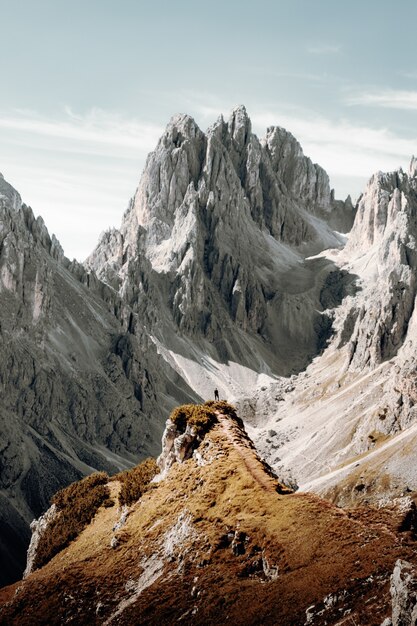 Brown and gray rocky mountain under white cloudy sky during daytime