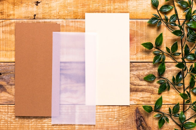 Brown invitation on wooden table