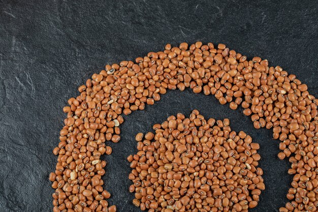 Brown kidney beans isolated on a dark