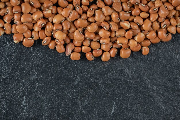 Brown kidney beans isolated on a dark