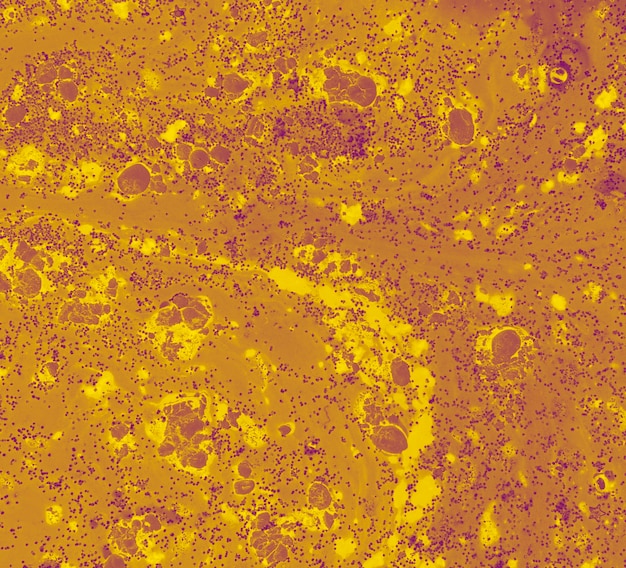 Brown liquid with yellow blurs