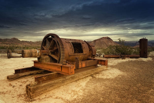 Brown metal equipment on field at daytime