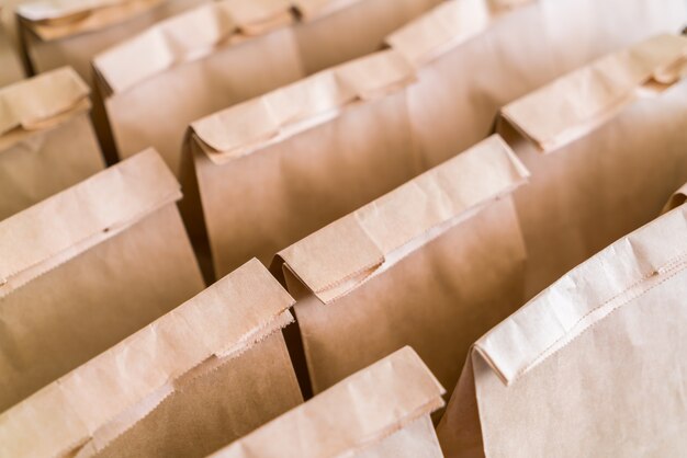 Brown paper bags on table .
