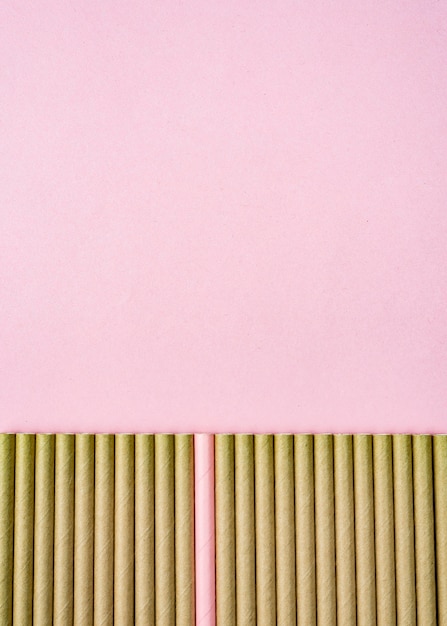 Brown paper straws pink copy space background