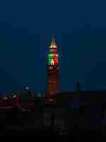 Free photo brown and red tower during night time