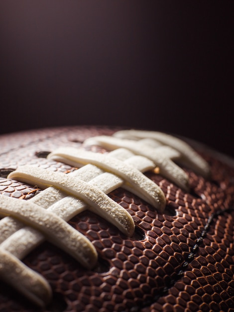 Brown rugby ball with white laces