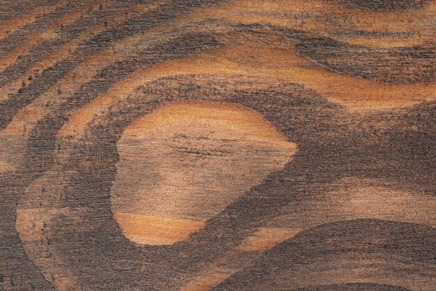 Brown scratched wooden cutting board. Wood texture