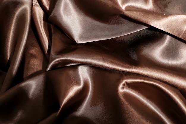 Текстура коричневой шелковой ткани