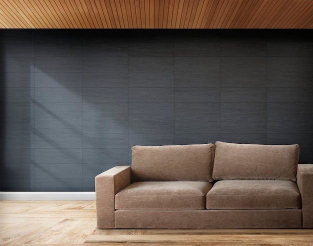 Brown sofa in a room with gray walls