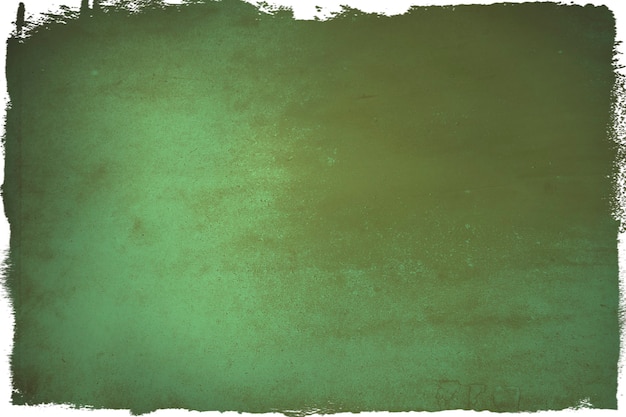 Free photo brown stained on a green paper background