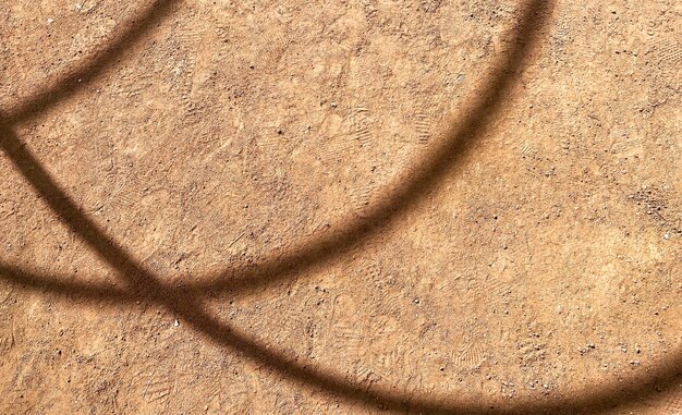 A brown stone floor with a circle of light on it and the word " light " on it.