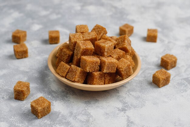 Brown sugar cubes on concrete ,top view