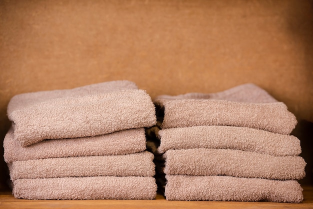 Brown towels sitting on the shelf