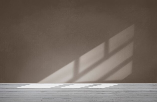 Brown wall in an empty room with concrete floor