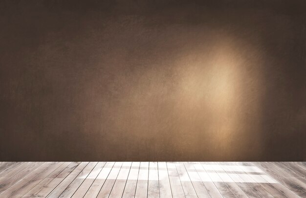 Brown wall in an empty room with a wooden floor