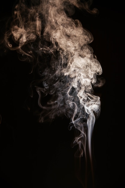 Brown wavy smoke on black background