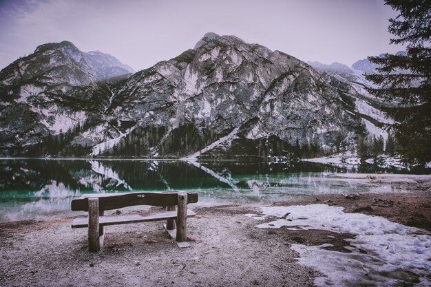 Brown Wooden Bench Near Mountain Hill