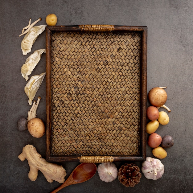 Free photo brown wooden table with spices on a grey background