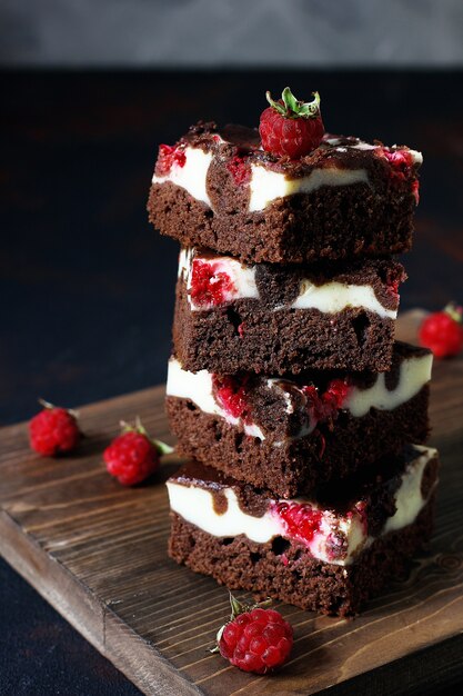 Brownies tower with cottage cheesecake and raspberries