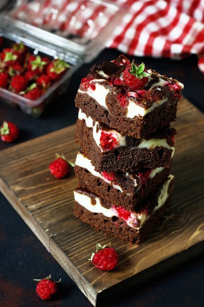Brownies tower with cottage cheesecake and raspberries