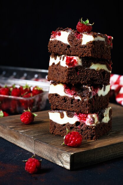 Brownies tower with cottage cheesecake and raspberries