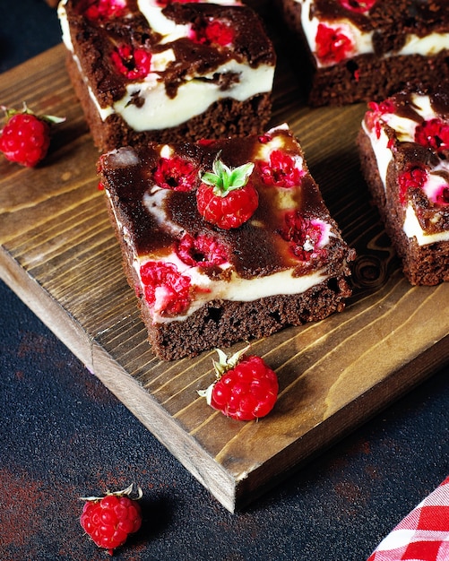 Brownies tower with cottage cheesecake and raspberries